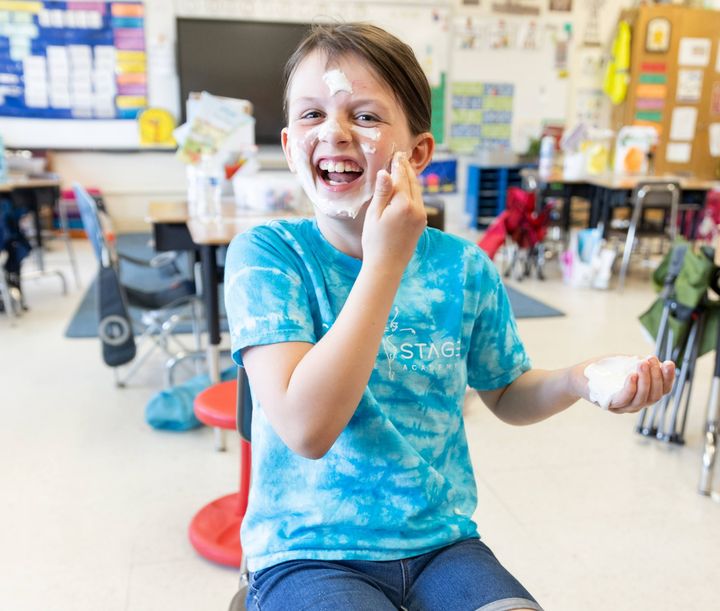 Emma Rogers (3) laughs as she tries an edible face mask in parent Leah Ederer's "Spa Day" class.