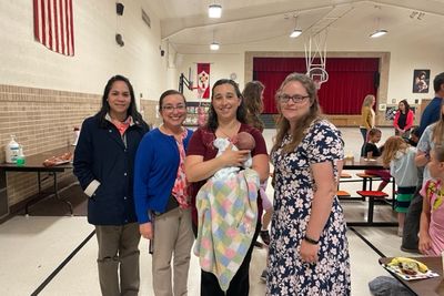 Miss Navarro, Ms. Andrea and Mrs. Hruby pose with Mrs. Krejchik and baby Isabella Mae.