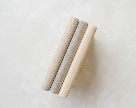 Spines of 3 photo books in natural color linen binding