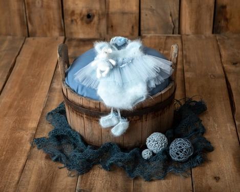 Old wooden tub with light blue girl baby set for newborn photography