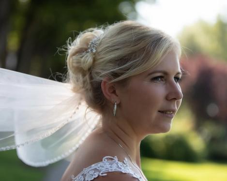 Side view of the bride with updo and veil