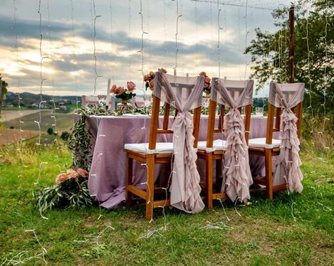 Beautifully decorated wedding table in pink in an outdoor evening atmosphere 
