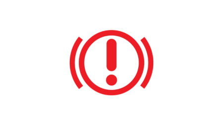 Varoitusvalossa näkyvä symboli: Punainen ympyrä ja huutomerkki