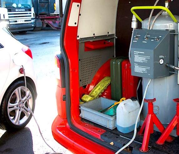 Viking service vehicle draining the fuel tank of a car.