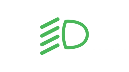 Varoitusvalossa näkyvä symboli: Vihreä valo ja vinoja viivoja