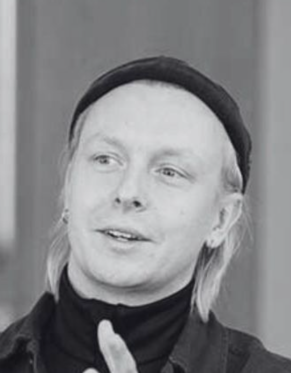 head shot, wihte man wearing a hat looking to the left in black and white