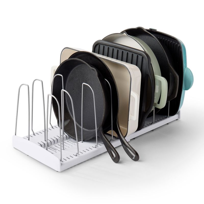 YouCopia StoreMore speckled-white expandable rack holding cookware upright between adjustable dividers