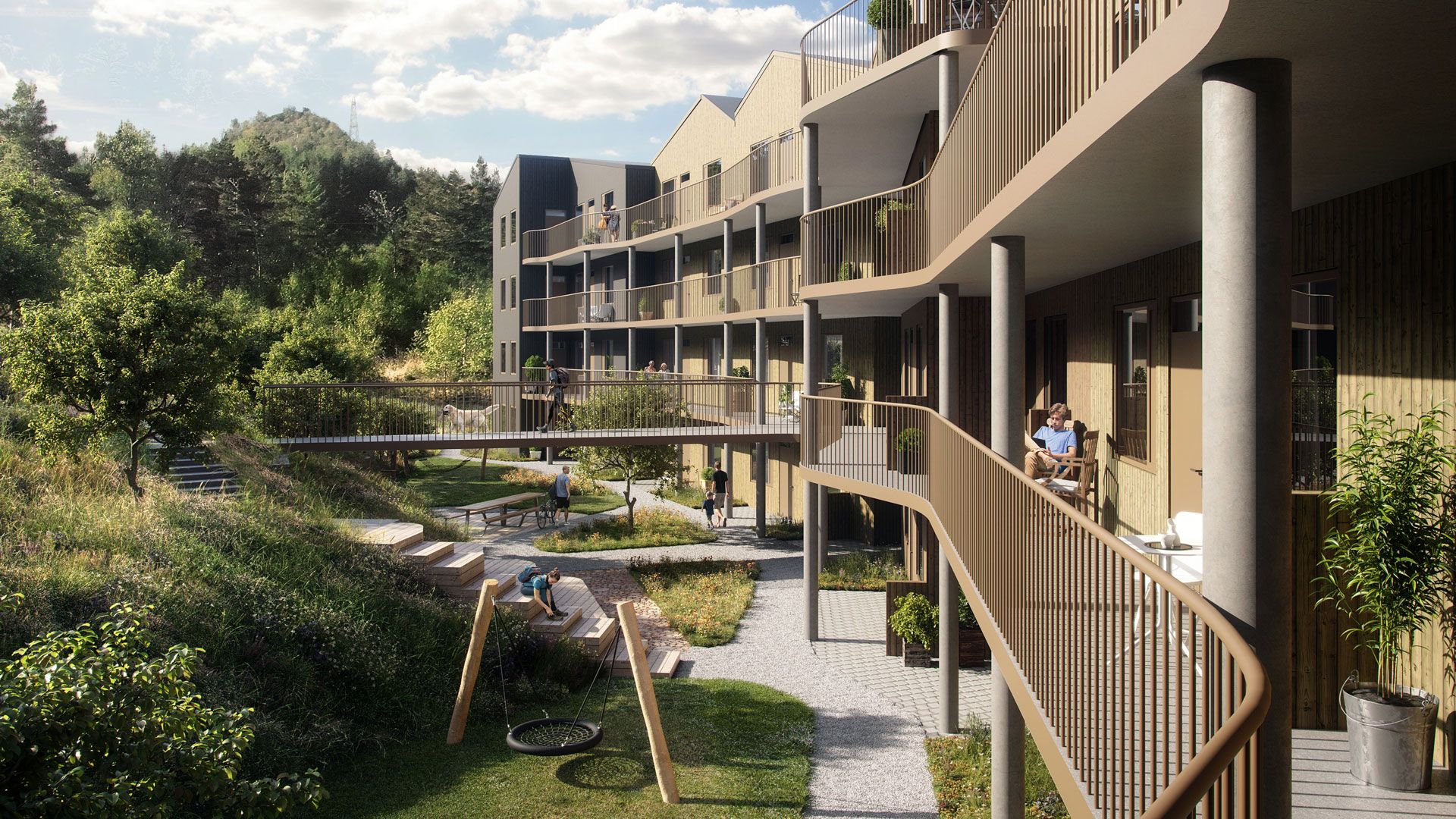 Inngangsparti til leilighetene i Skogens ro. En gangbro knytter byggene sammen med skogen.