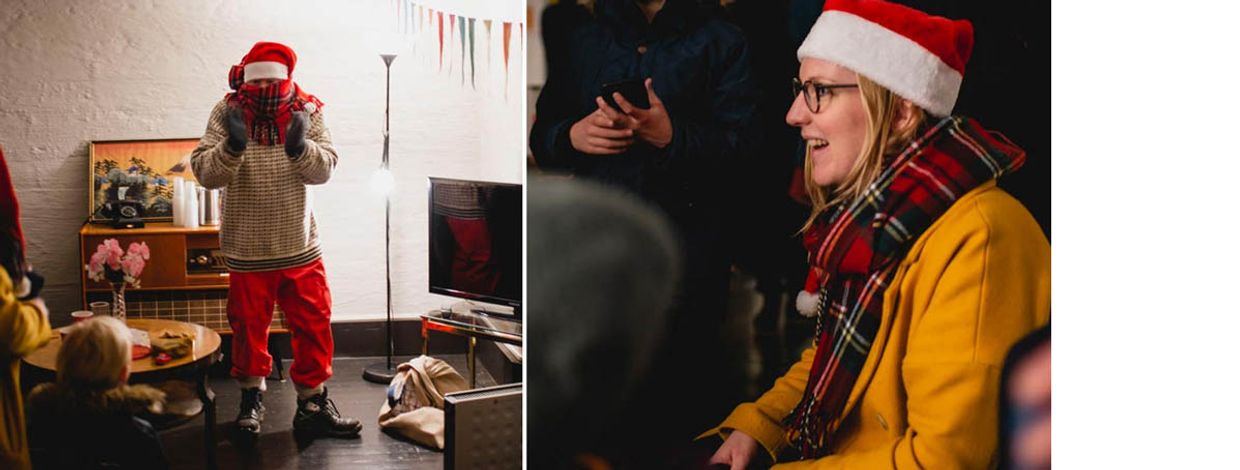 Mann utkledd som nisse og dame med nisselue