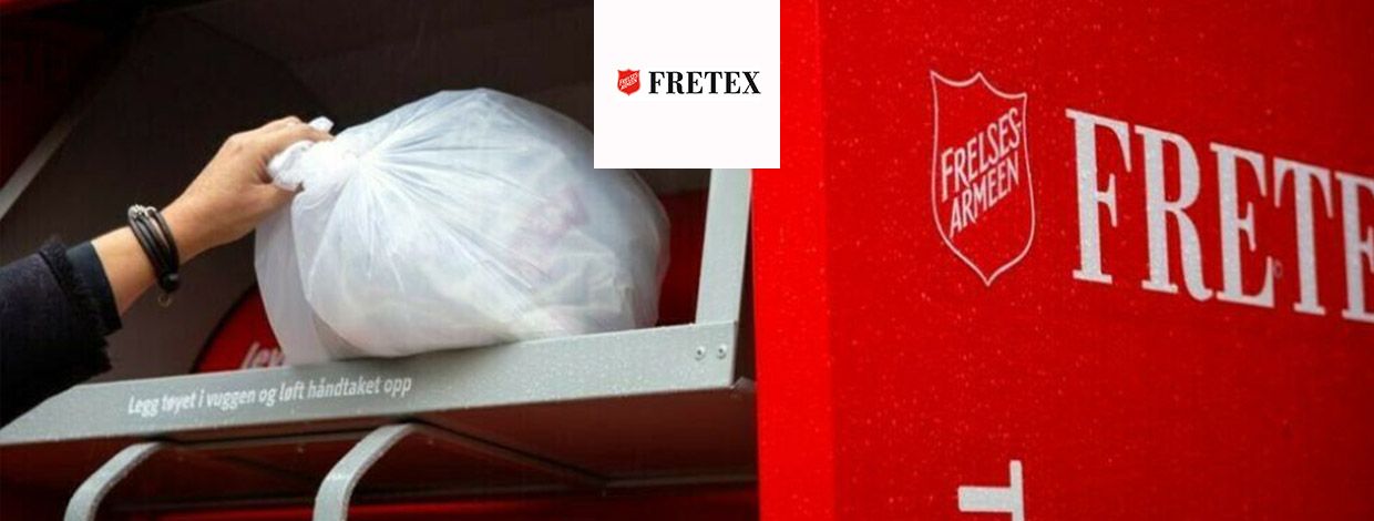 Fretex-bil utenfor Fretex-butikk