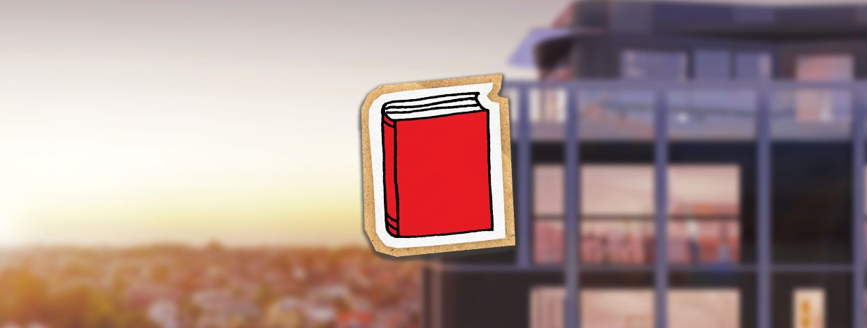 illustrasjon av bok foran en boligblokk