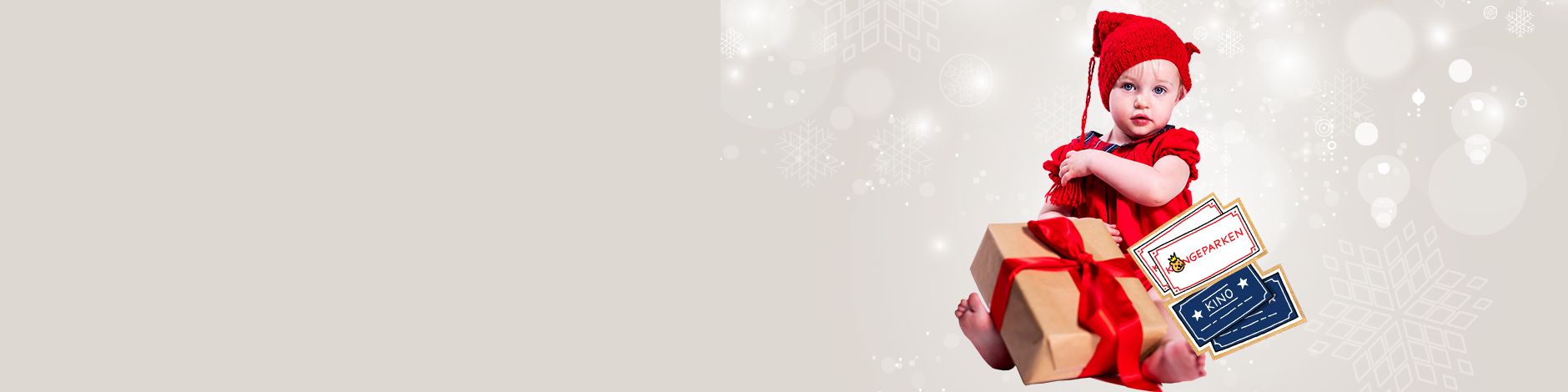 jentebaby med gave og billetter