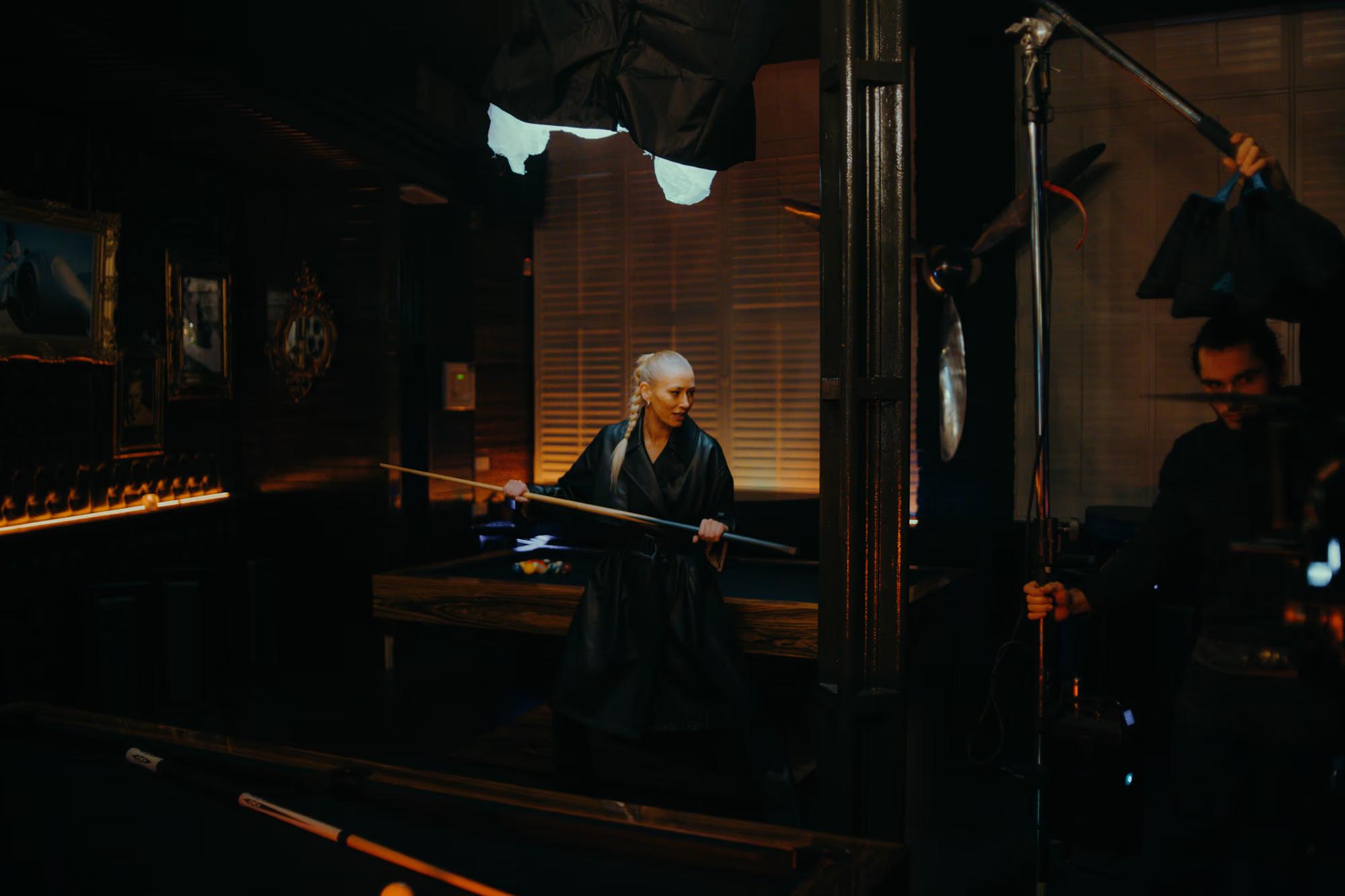Moody interior of a London pub being used as a film location, featuring professional cinematography equipment.
