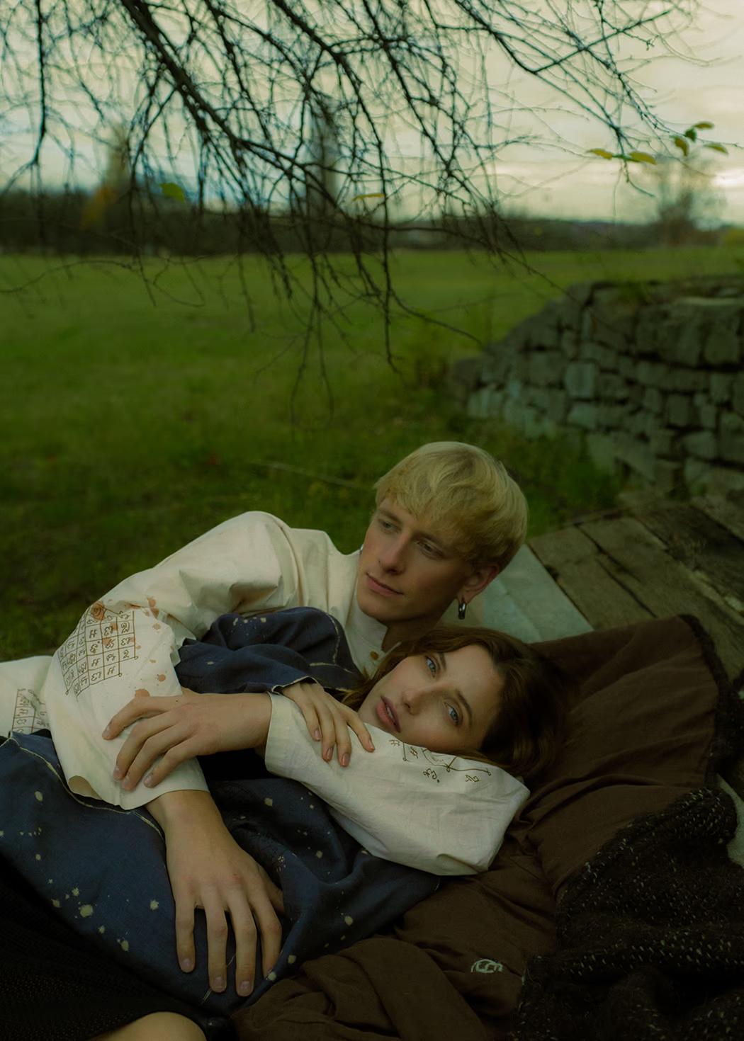 Atmospheric fashion moment: models in the tall grass near historic farmsteads, celebrating heritage and slow fashion in Pirogovo.