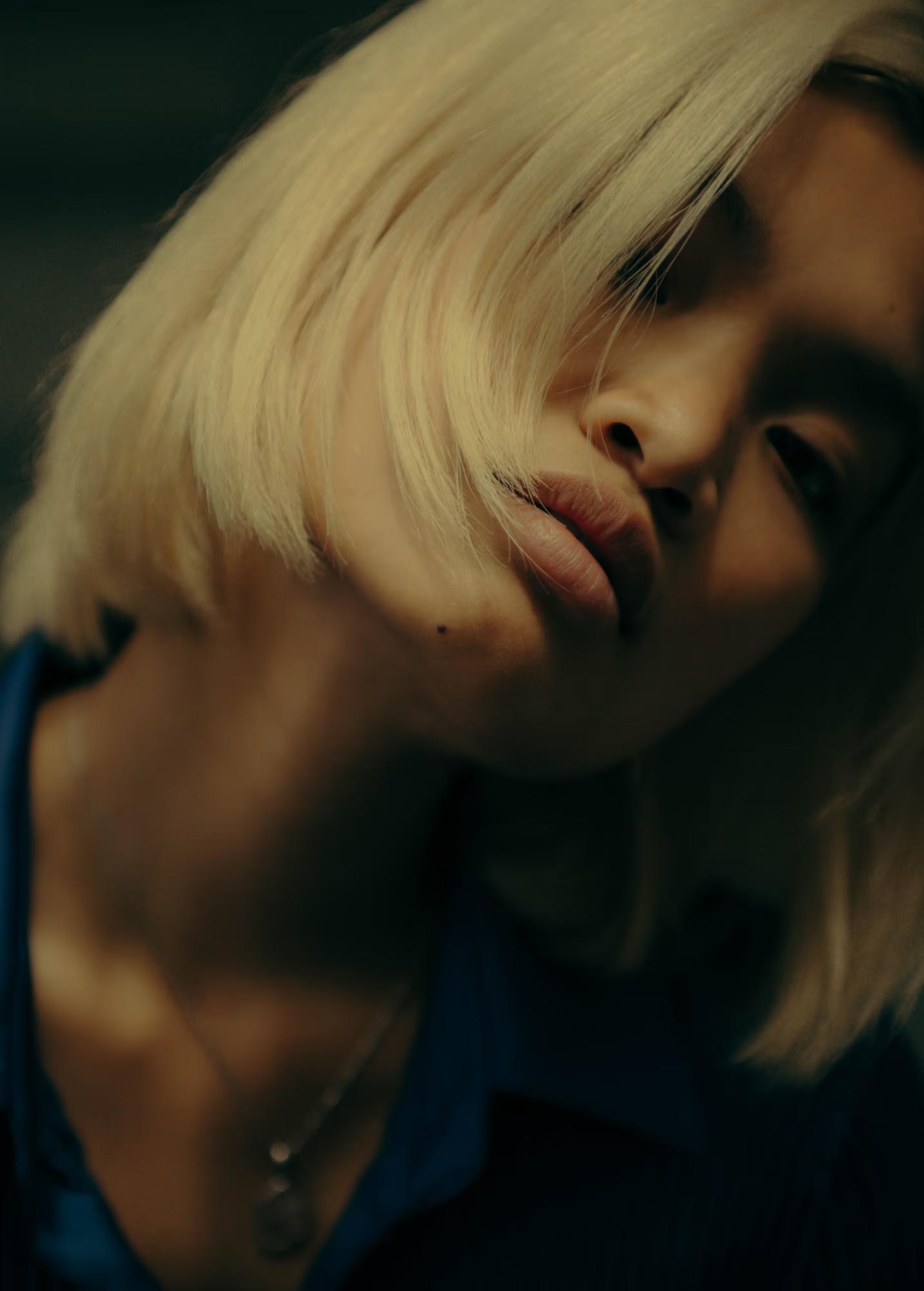 Soft focus close-up of blonde model, artistic beauty portrait with natural light