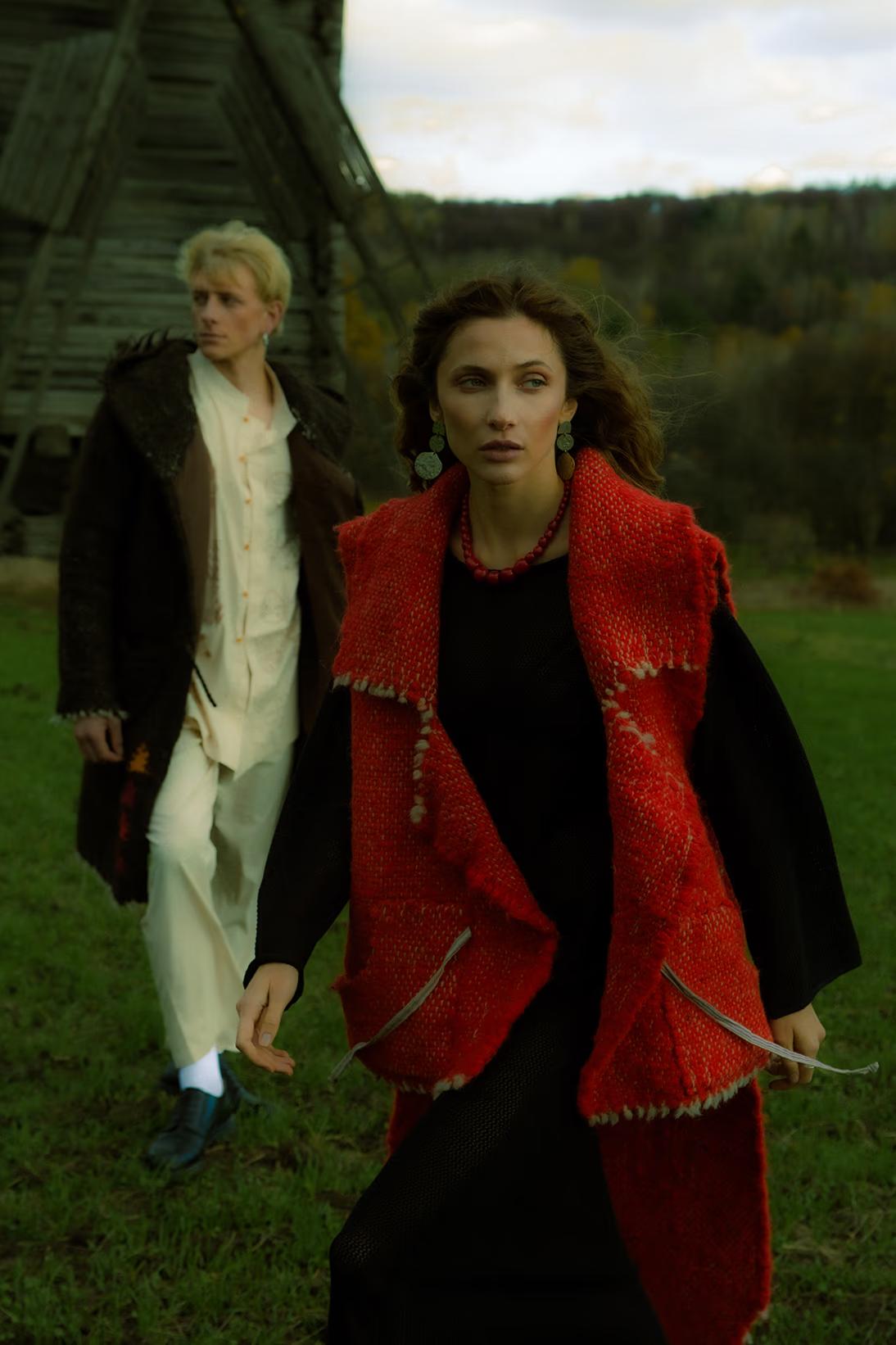 campaign shot of models in high-fashion fusion wear walking through the historic architecture of Pirogovo, Kyiv.