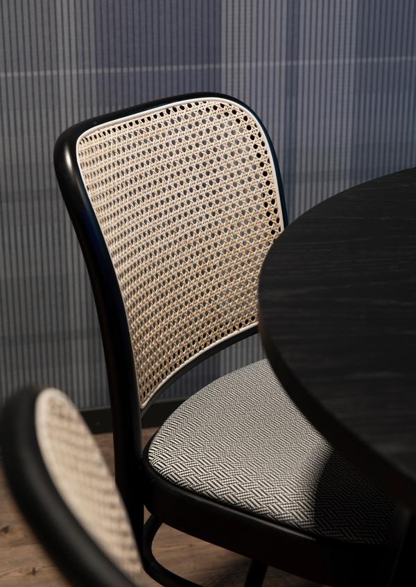 The picture shows a detail of a meeting room.