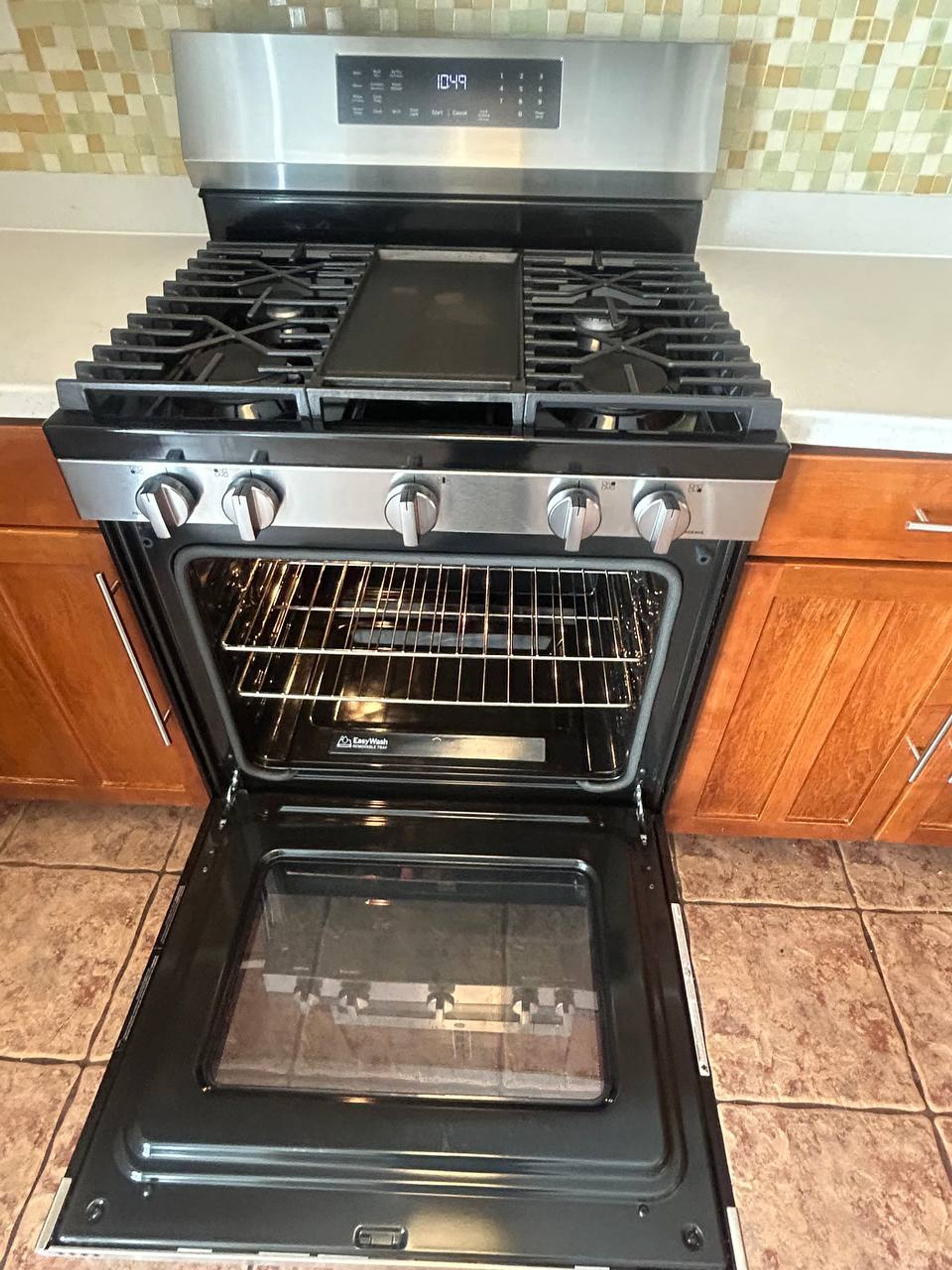 Gas range with open oven, clean racks and clean door glass