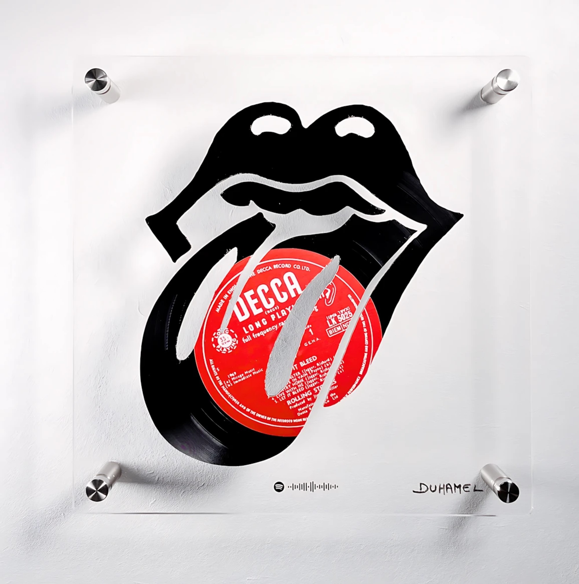 Logo des Rolling Stones représentant une composition visuelle et sonore complexe réalisée à partir de disques vinyles.