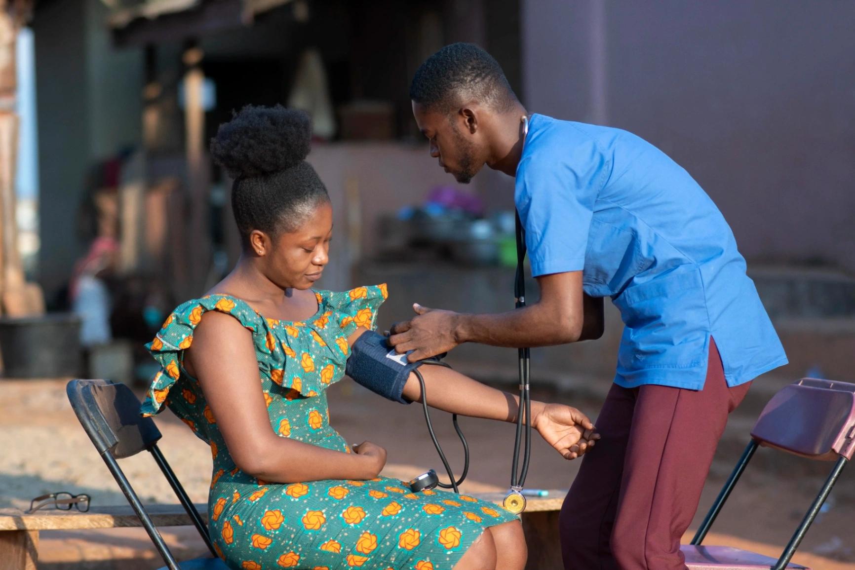 A doctor taking screening a patient