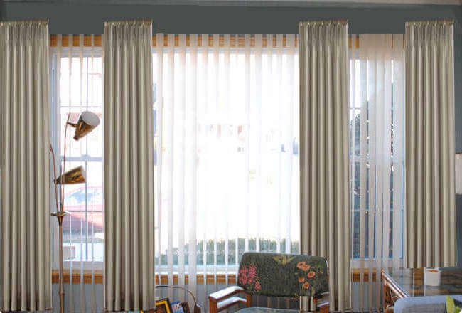 how to hang curtains over vertical blinds