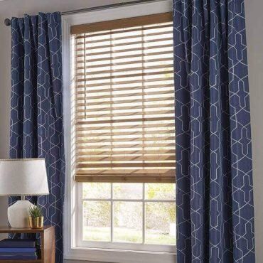 Curtains over outlet blinds