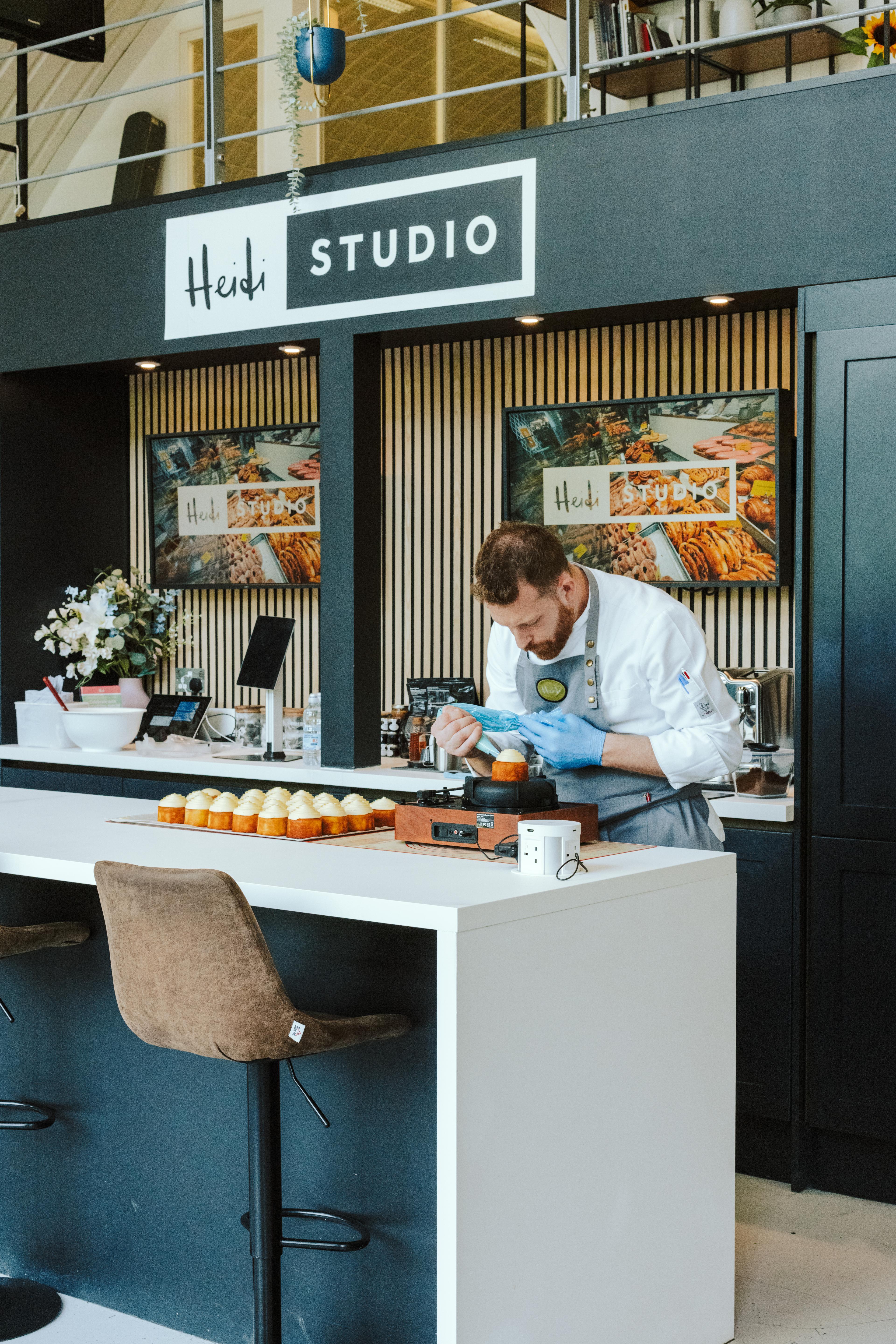 Head Chef Vincenzo icing cakes in Heidi Studio