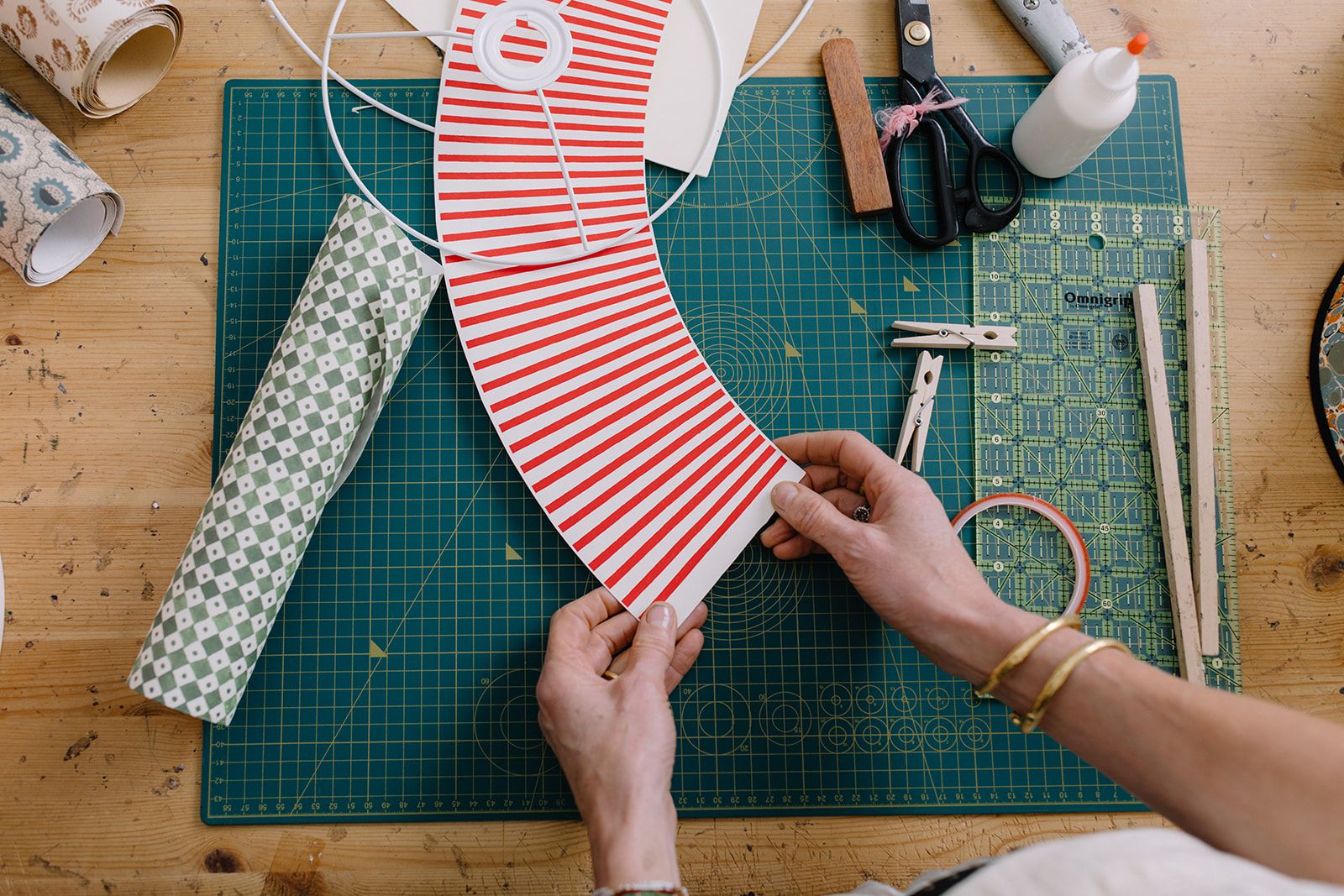 Rosi de Ruig holds a lampshade cut out