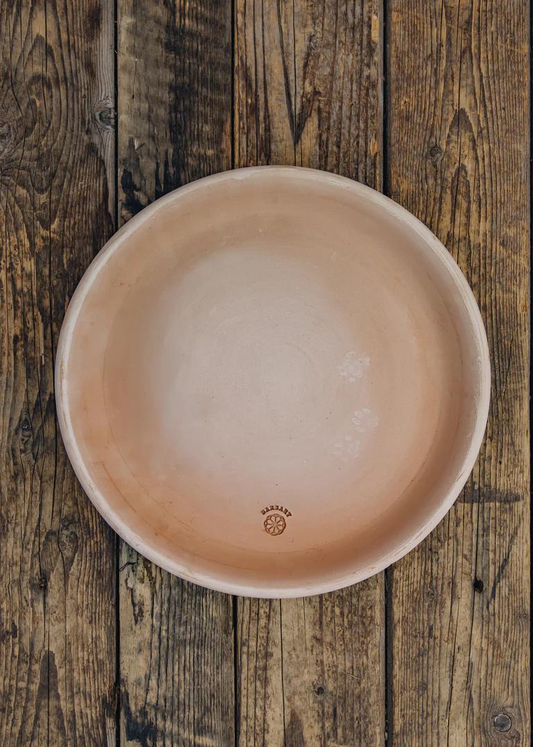 a large terracotta saucer for a pot. 