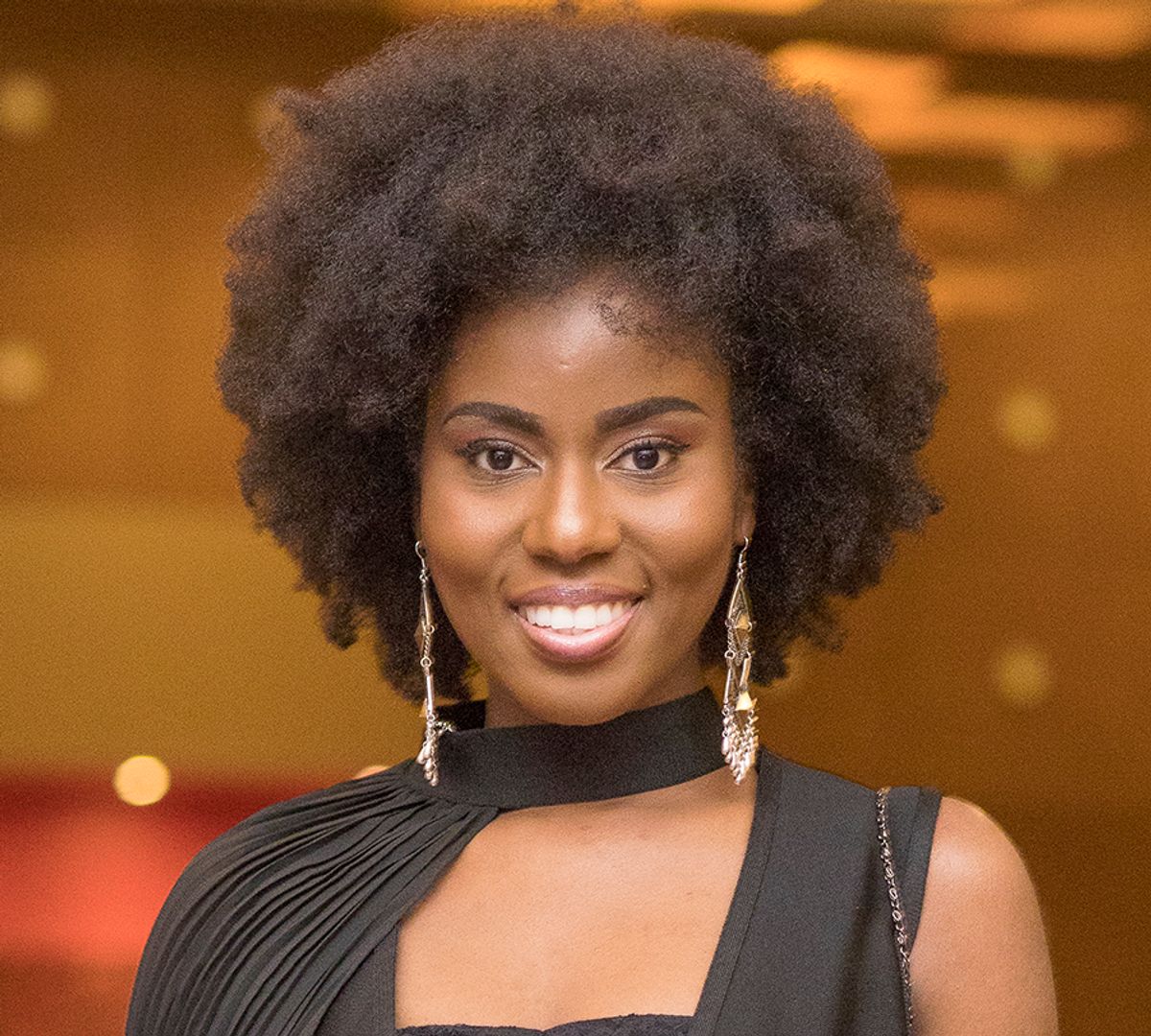 Vera Hamenoo-Kpeda aka MzVee smiling at the camera