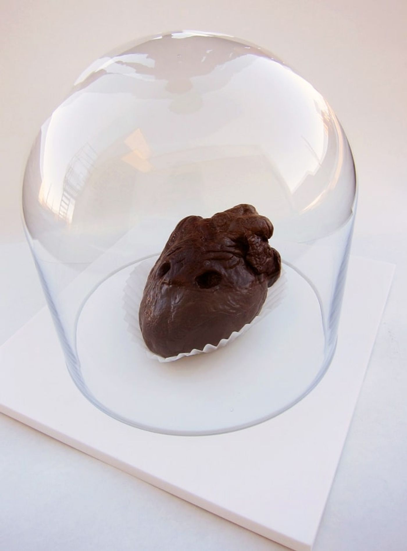 COP SUICIDE______chocolate molded from heart with bullet went through