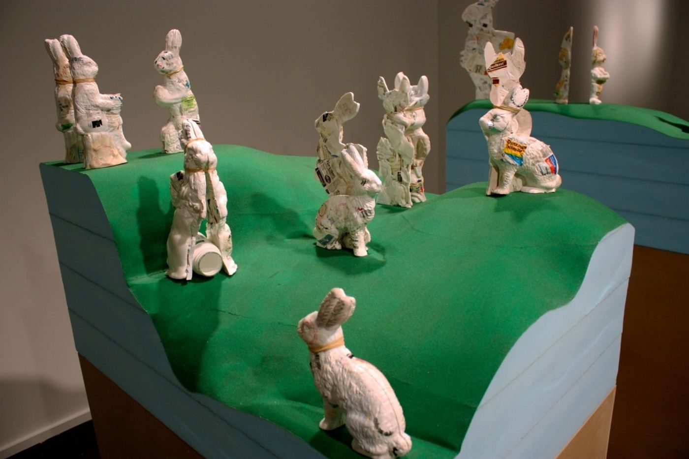 HOPPING HILLS, THE PHARMACEUTICAL LANDSCAPE_______pill bottles melt into the form of Easter Bunnies, wood, foam / 250X 300X 150 cm / 2009