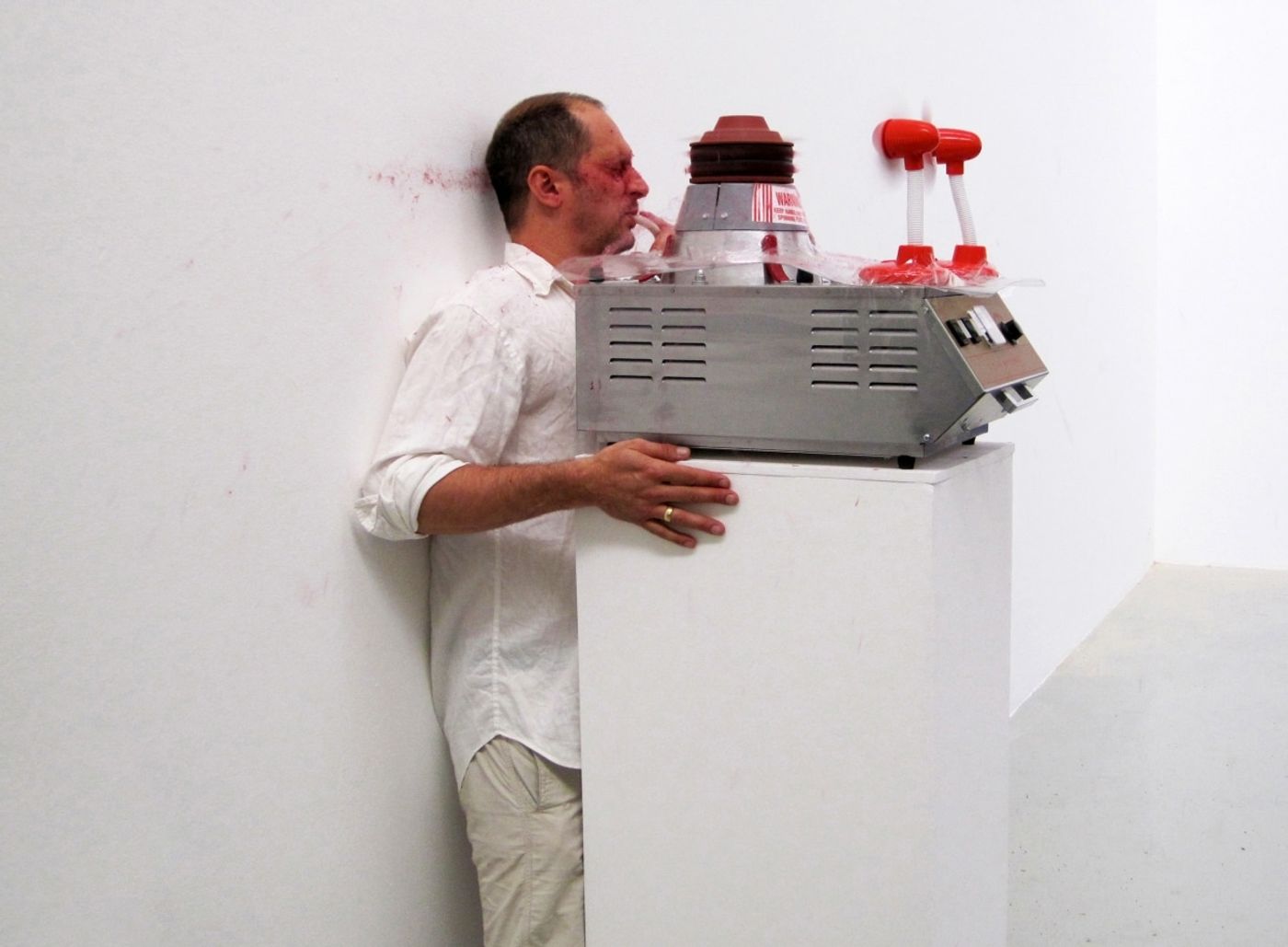 SLAPPED IN THE FACE TILL YOUR SHIT TURNS RED_______performance, cotton candy machine/ 2009 / CAN, Centre d'Art Neuchâtel, Switzerland