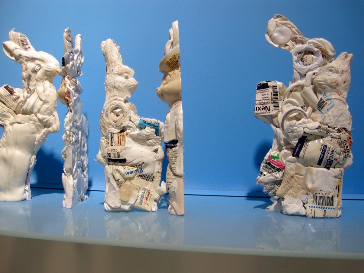 PHARMACEUTICAL LANDSCAPE_______30 x 500 cm / melted pill bottles in the form of Easter bunnies, glass