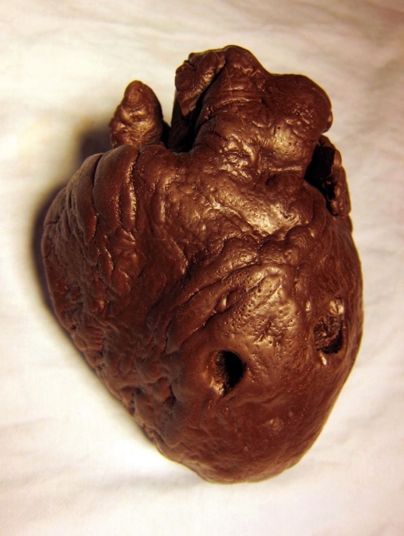 COP SUICIDE______chocolate molded from heart with bullet went through