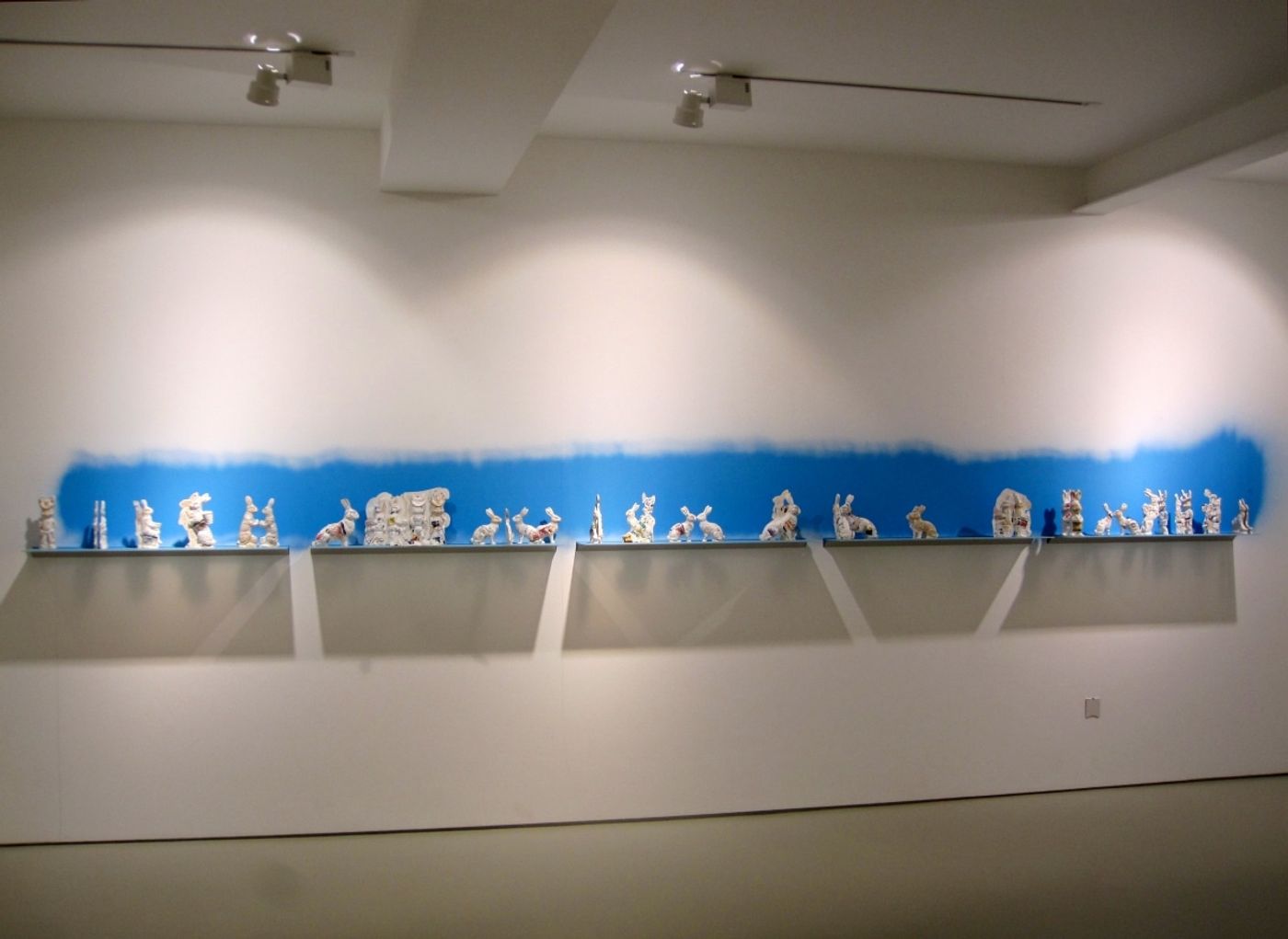 PHARMACEUTICAL LANDSCAPE_______30 x 500 cm / melted pill bottles in the form of Easter bunnies, glass