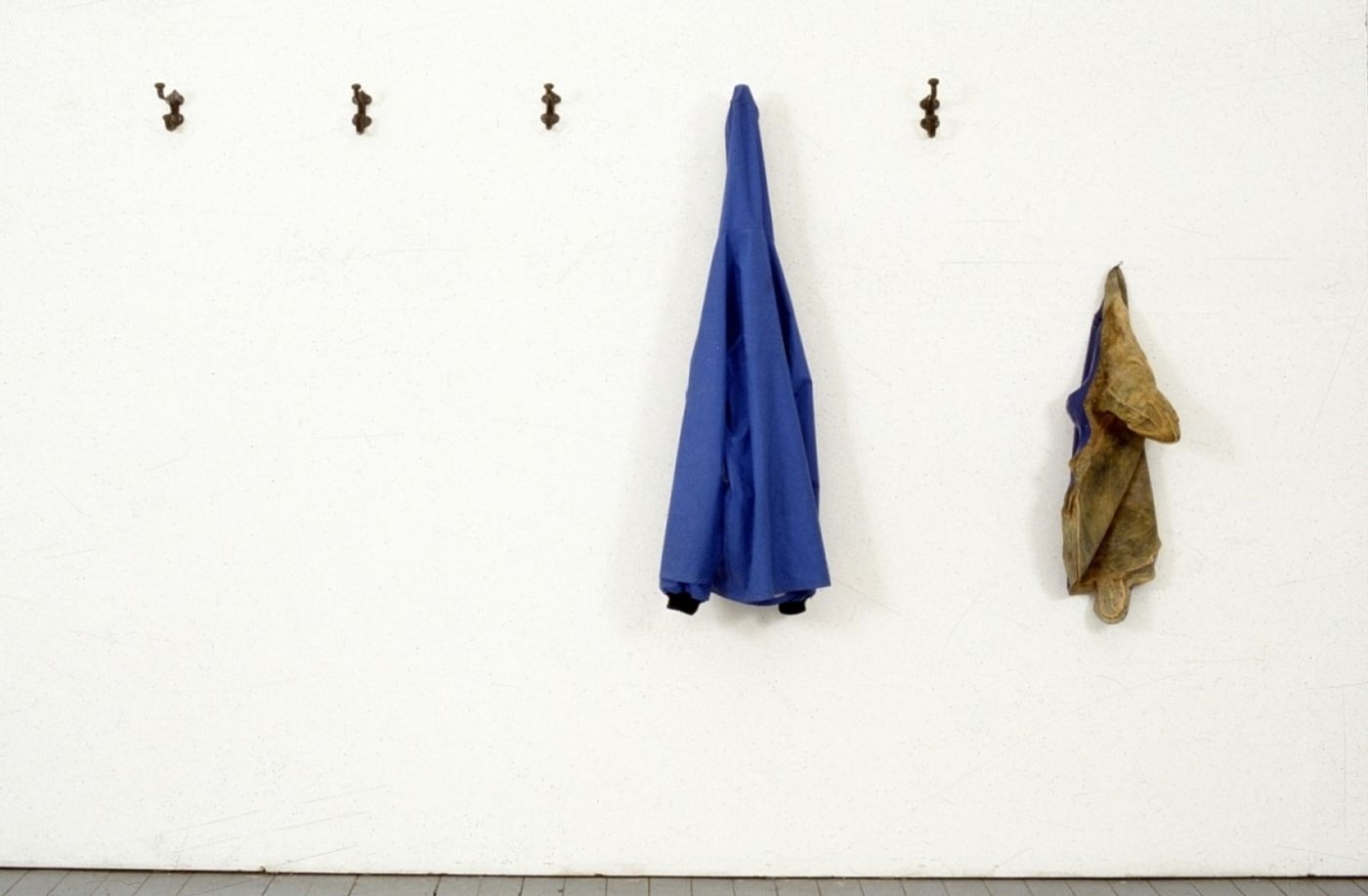 A POSE FOR A DRY PHOTOGRAPH OF RAIN_______rain jacket , latex sea turtle / 1992