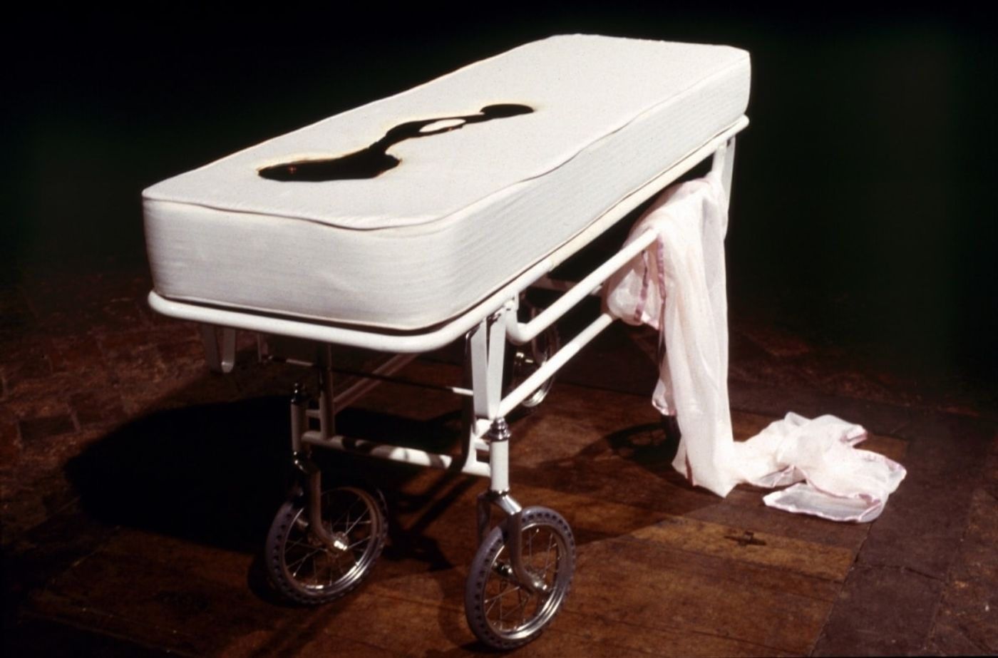 SLEEPING WITH CHOCOLATE_______autopsy table a self-contained unit, where chocolate is pumped to the surface and returns through a middle drain/ 1996