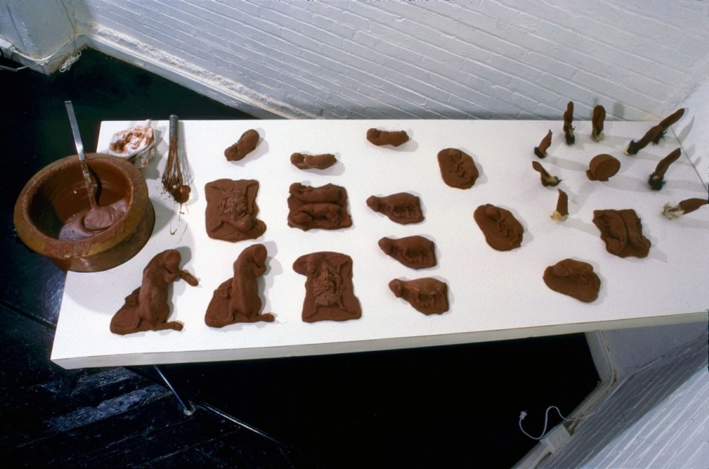 CHOCOLATE SOLILOQUY_______chocolate fetal goat casts, dried goat ears, alarm clock dipped in chocolate / 1989