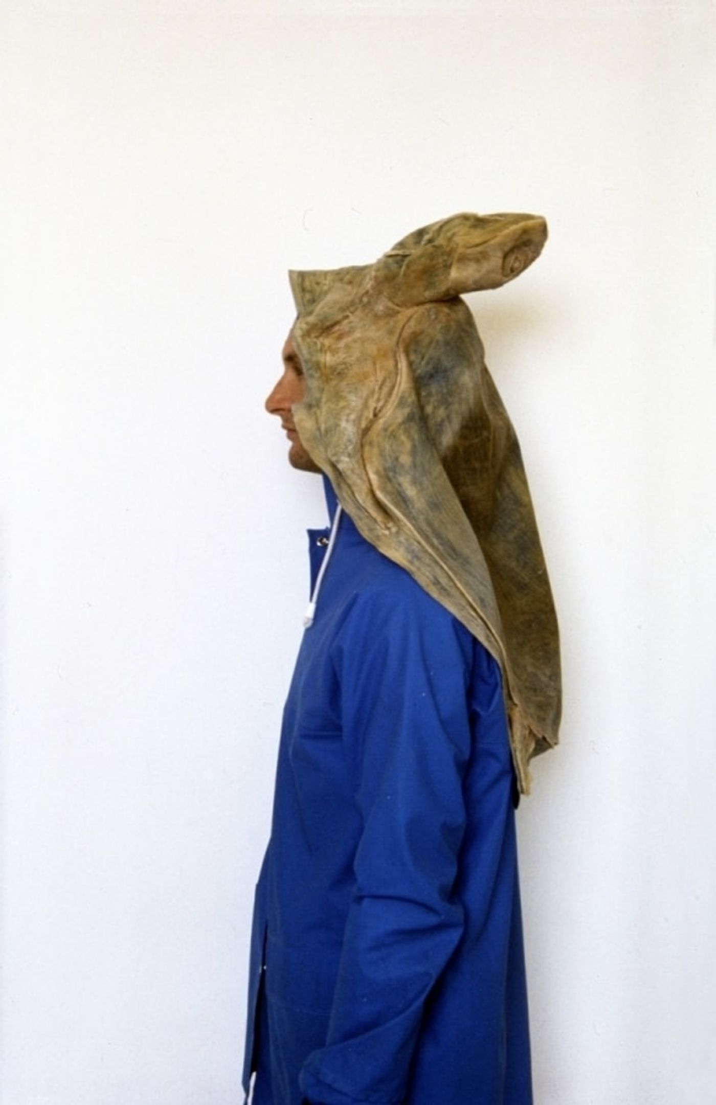 A POSE FOR A DRY PHOTOGRAPH OF RAIN_______rain jacket , latex sea turtle / 1992