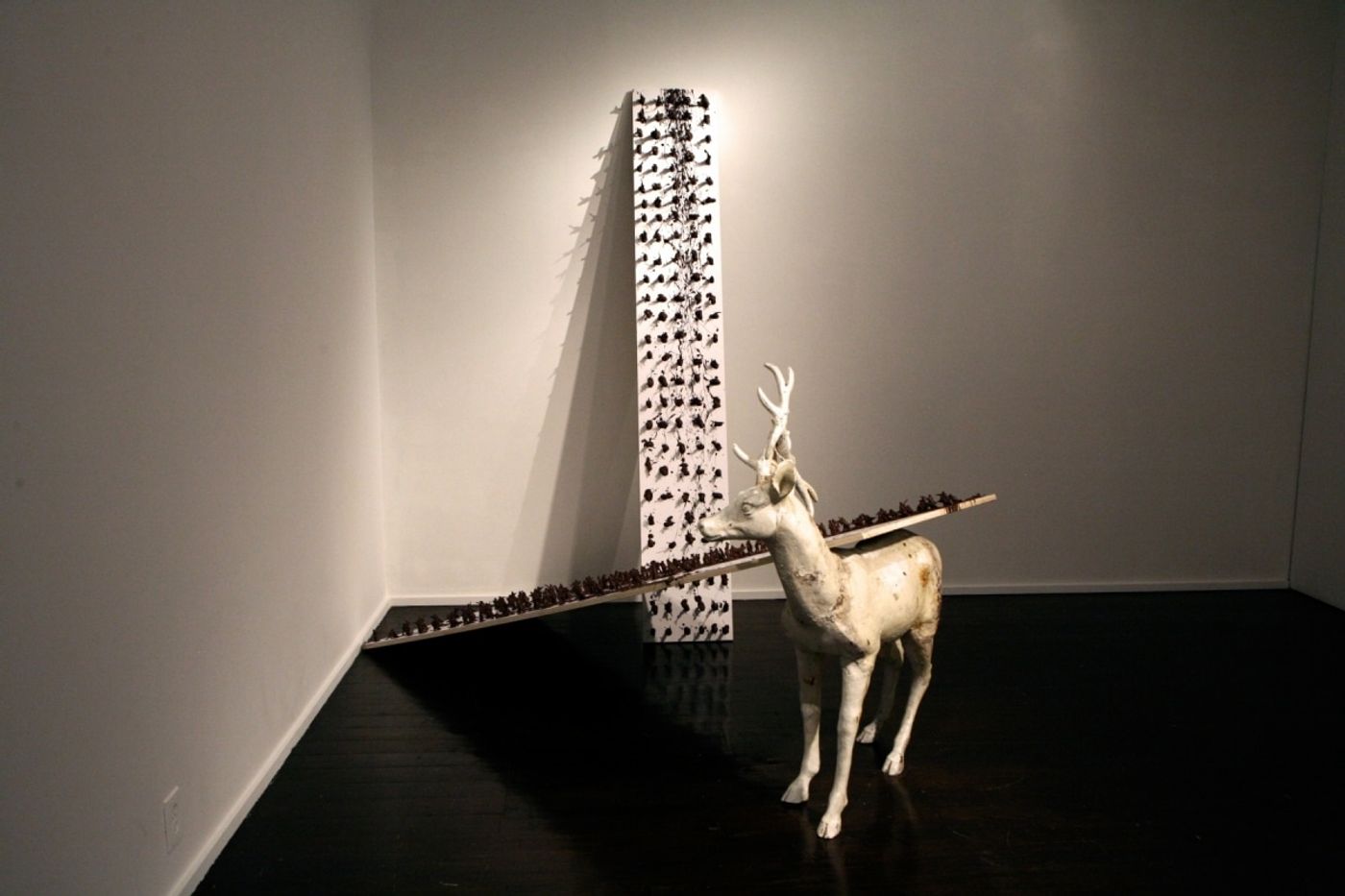 BATTLE OF LOSERS AND LOVERS_______plastic soldiers, chocolate, wood, iron cast deer / 250X 250x 320 cm