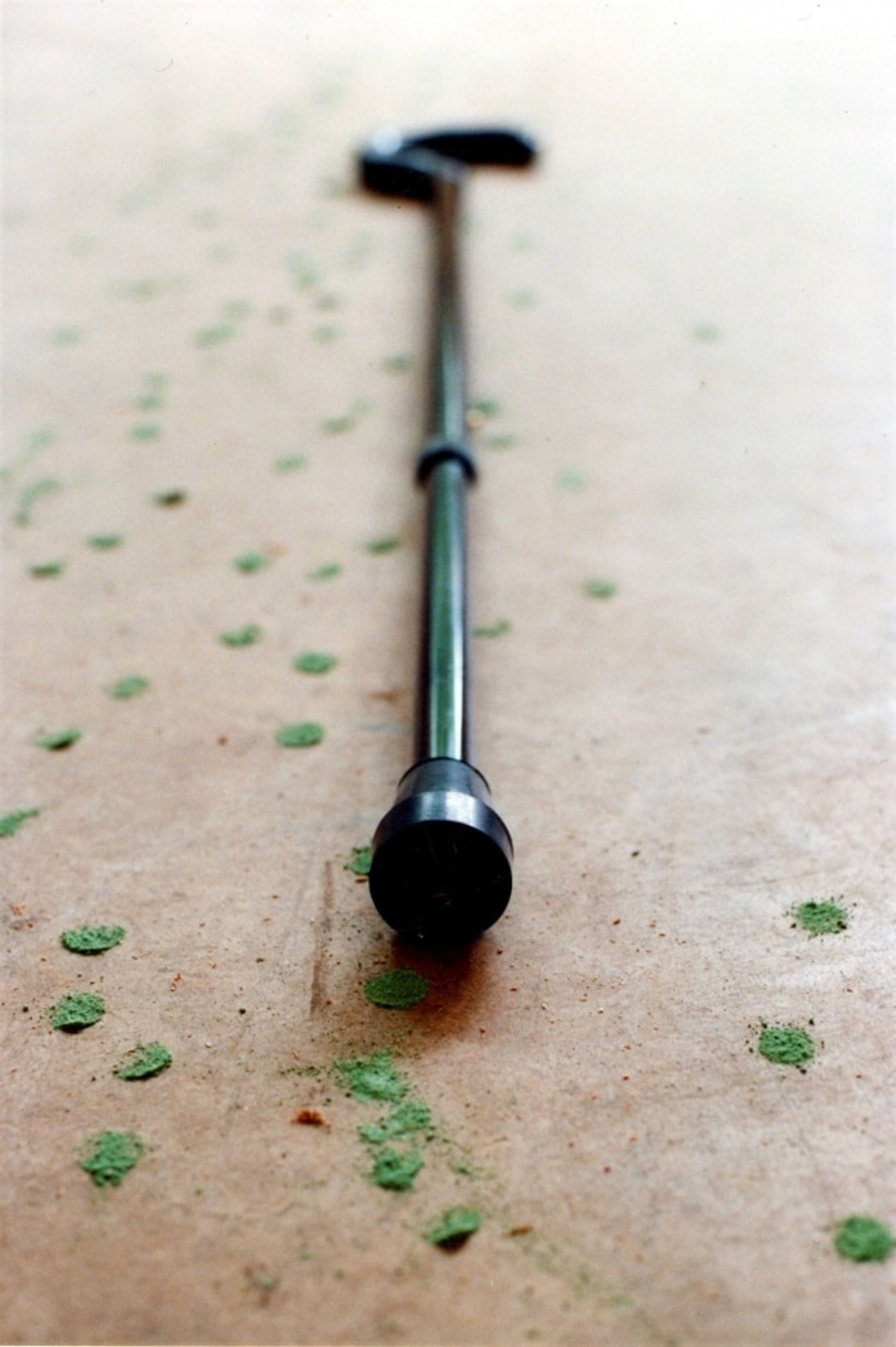 STIPPELBEEN ( POKKA DOT LEG)_______an ongoing walking performance with cane, filled with a mixture of phosphorescent powder and plaster. each placement leaves a lingering green dot / Moscow, Amsterdam, Pittsburgh /1993 —