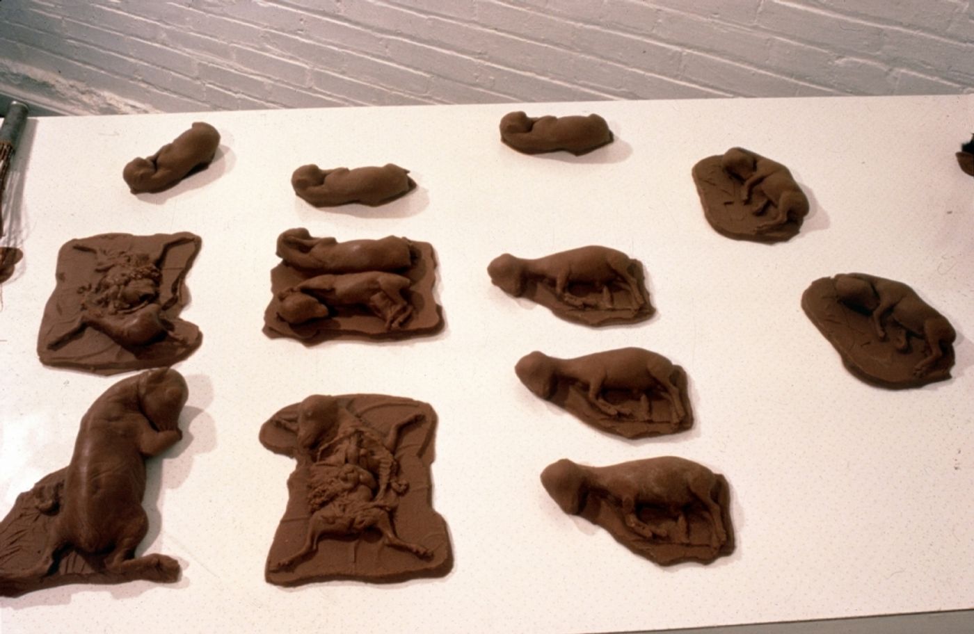 CHOCOLATE SOLILOQUY_______chocolate fetal goat casts, dried goat ears, alarm clock dipped in chocolate/ 1989