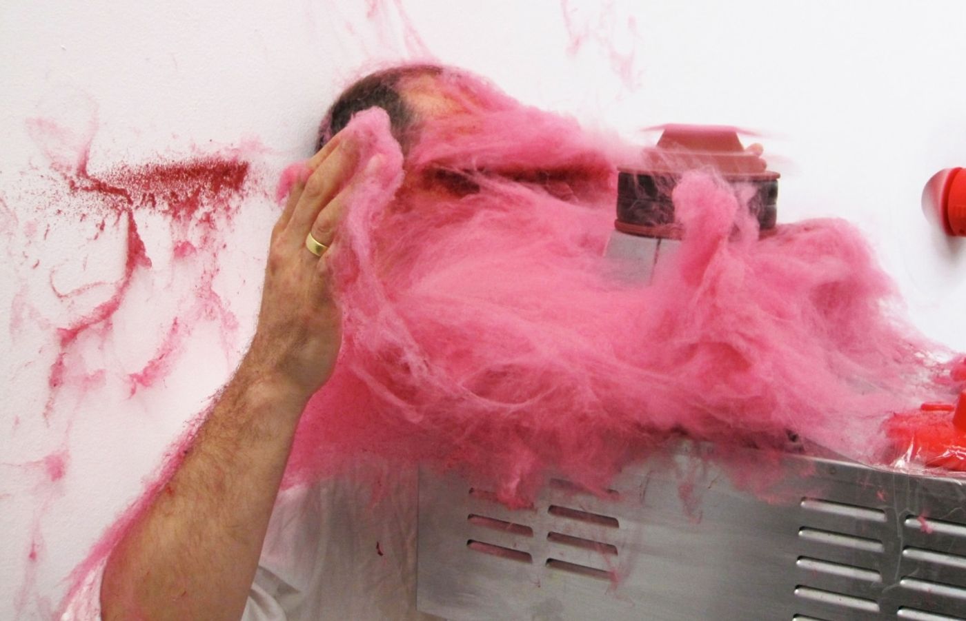 SLAPPED IN THE FACE TILL YOUR SHIT TURNS RED_______performance, cotton candy machine/ 2009 / CAN, Centre d'Art Neuchâtel, Switzerland