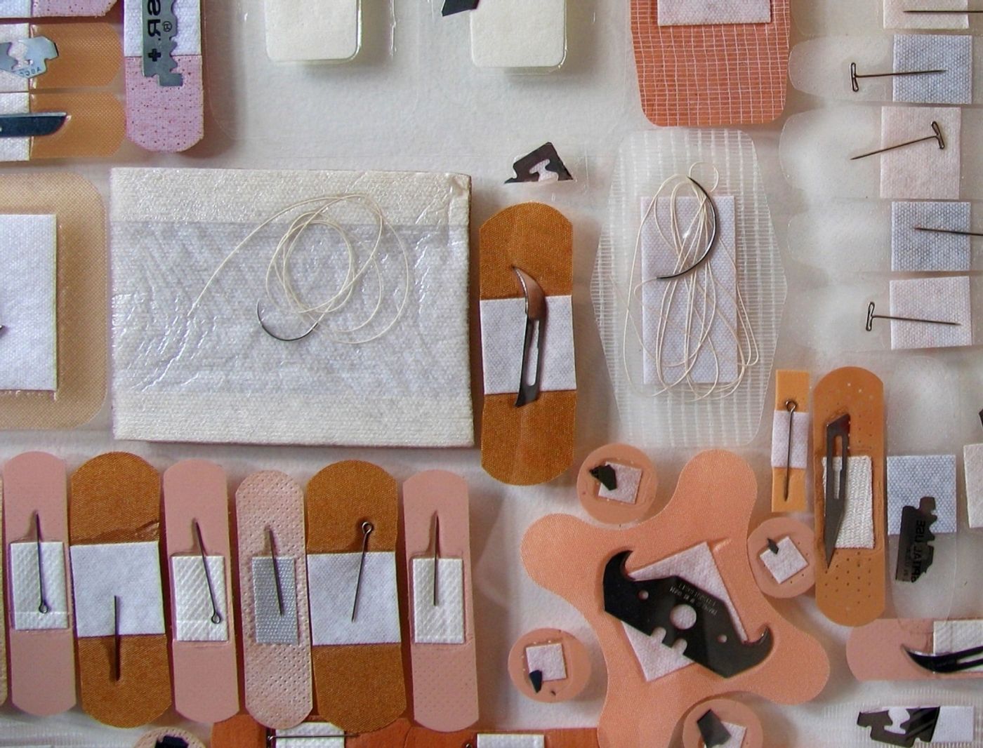 LOVE as a LIST OF VICARIOUS EDGES Series_______surgical scalpels, blades, pins, razors, bandages / various sizes / 2006 — 2010
