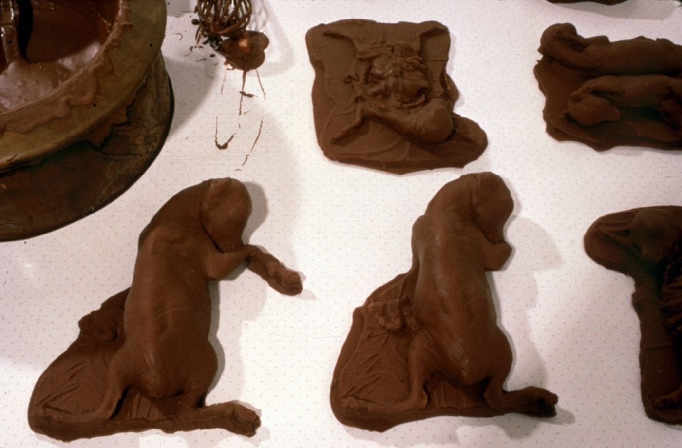 CHOCOLATE SOLILOQUY_______chocolate fetal goat casts, dried goat ears, alarm clock dipped in chocolate/ 1989