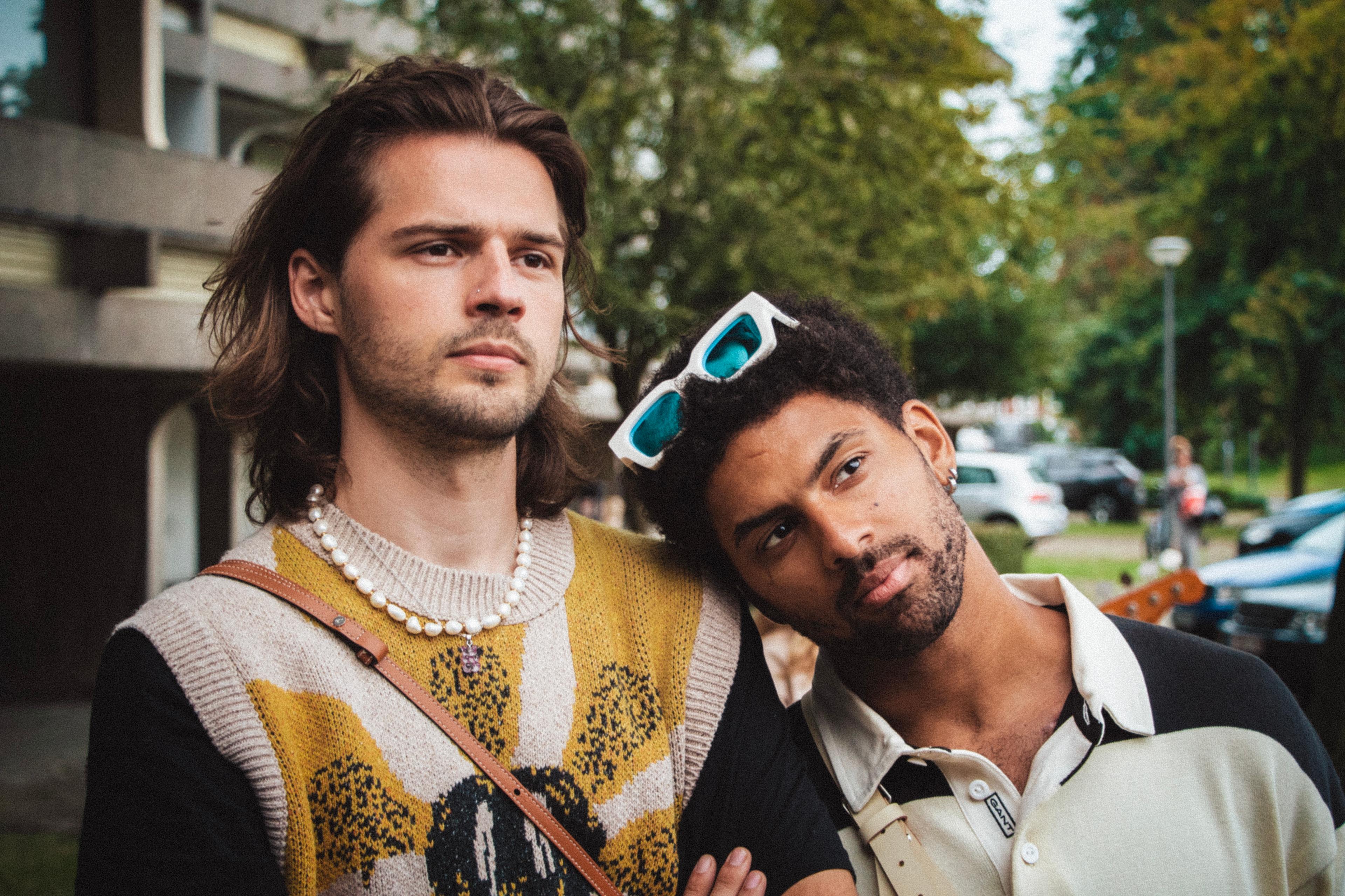 The main singers of the band Blackwave chilling on a playground.