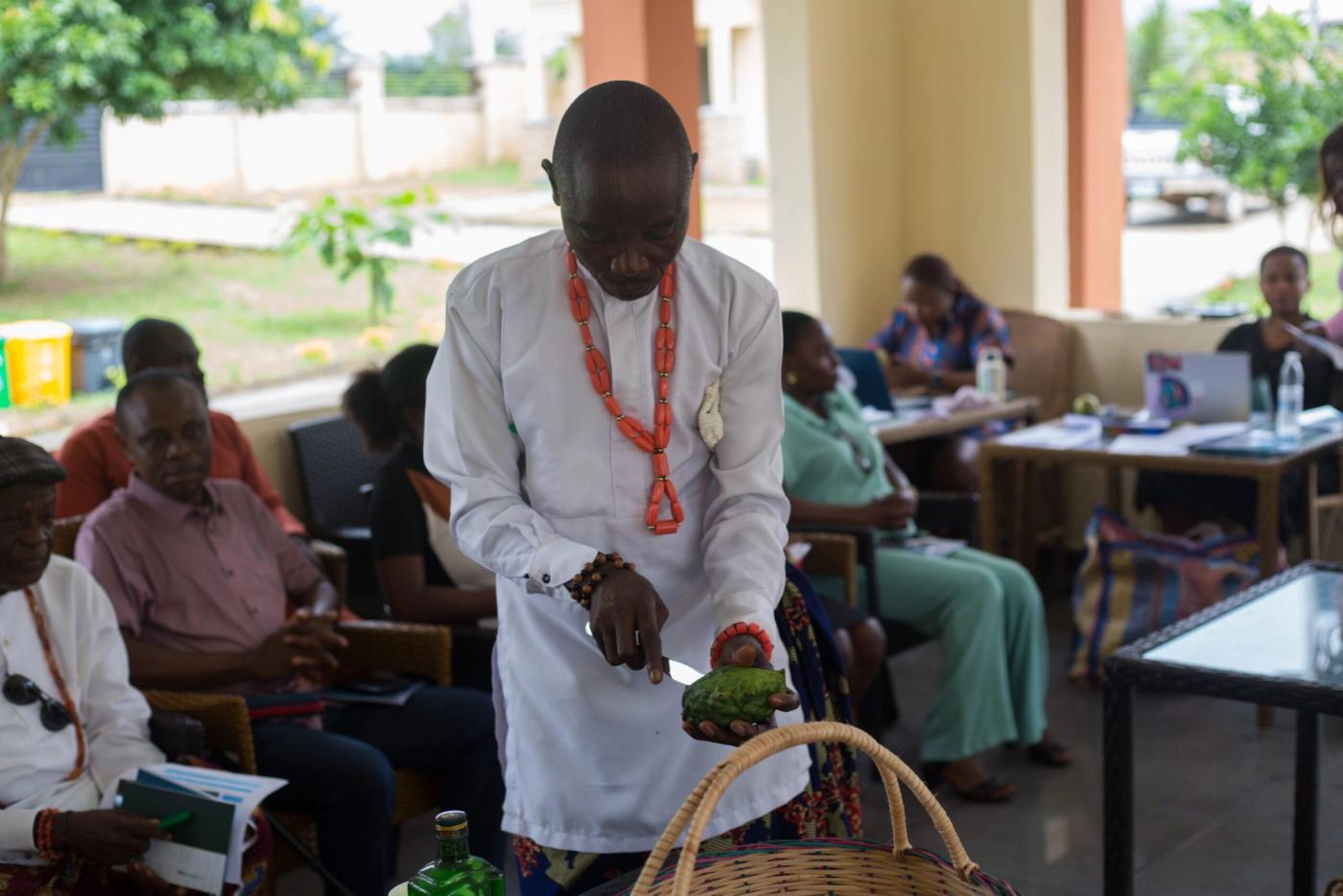 Guests gathered in the Afe hall at EtiUwem as kola nut is broken at the Wisdom Gathering, September 2026