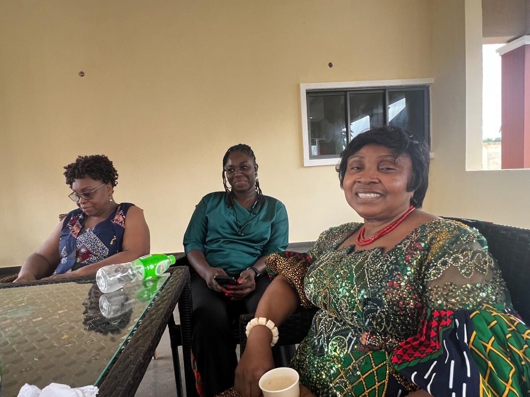 Participants seated in conversation at the table