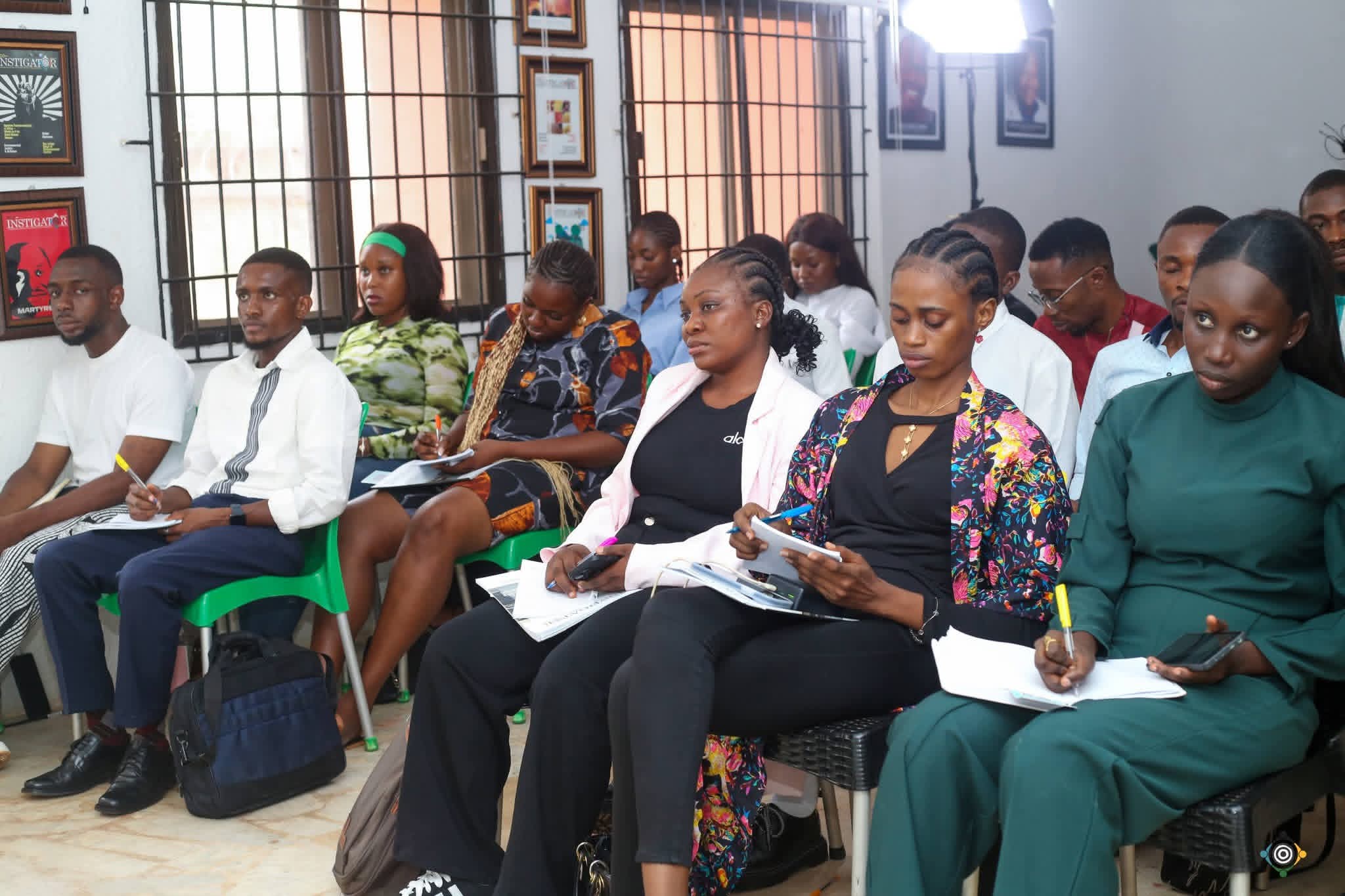 Participants taking notes at the School of Ecology